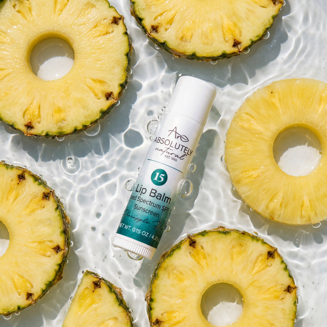 Lip balm with pineapple slices on a water surface